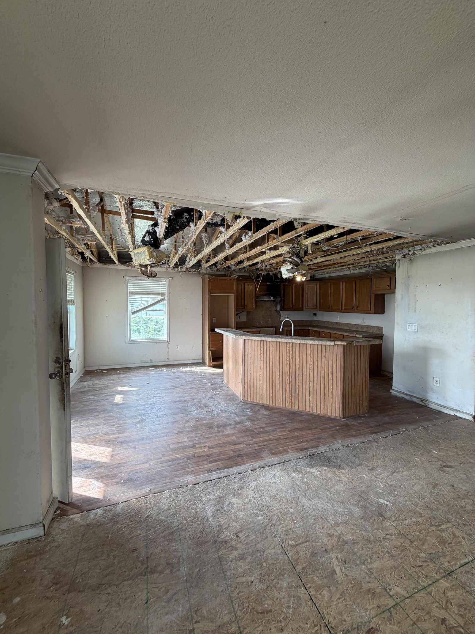 Storm-damaged interior of a home bought as-is by Mavro Properties